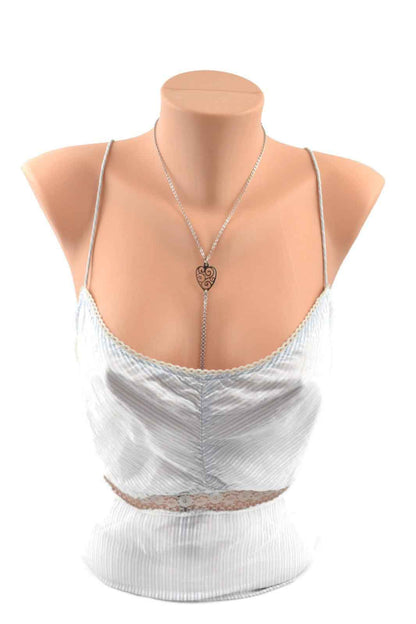 The Unchained Heart Collar with Nipple Chain on a mannequin wearing a silver camisole.