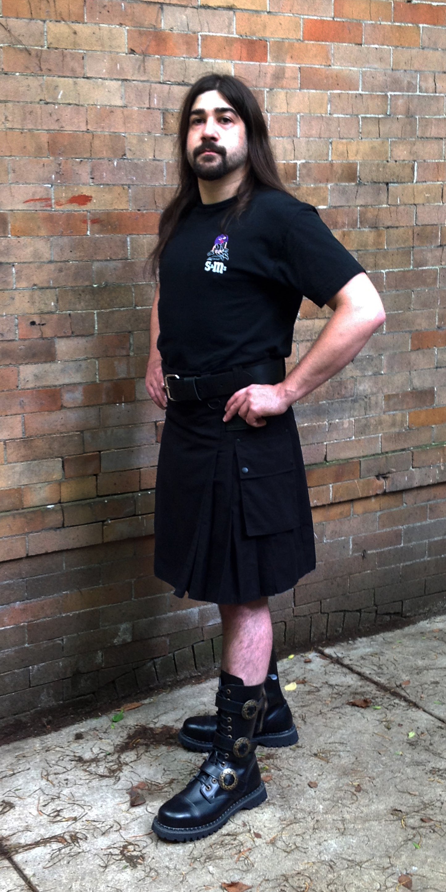 Model wearing the black cargo kilt.