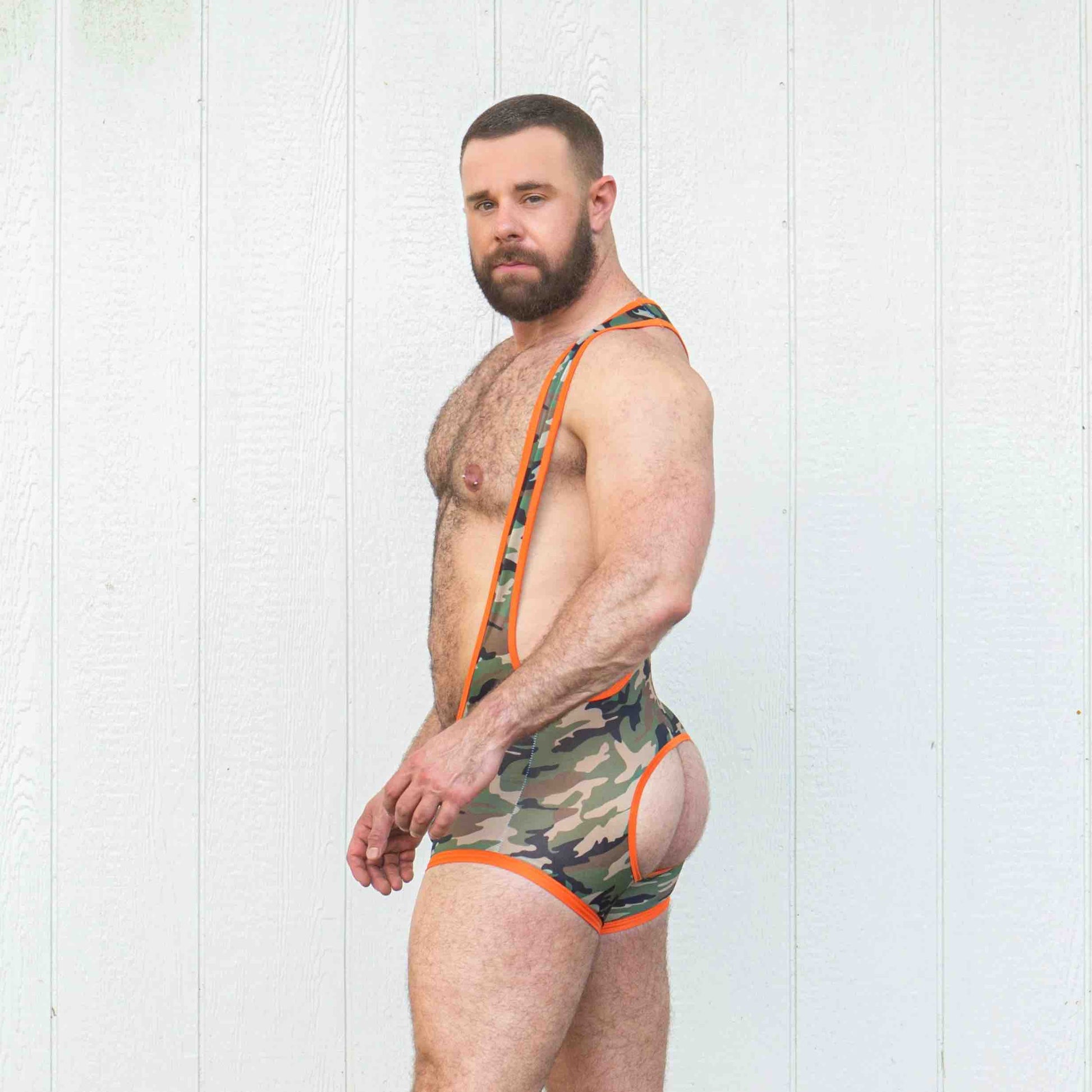 A model wearing the Combat Assless Mesh Singlet, side view.