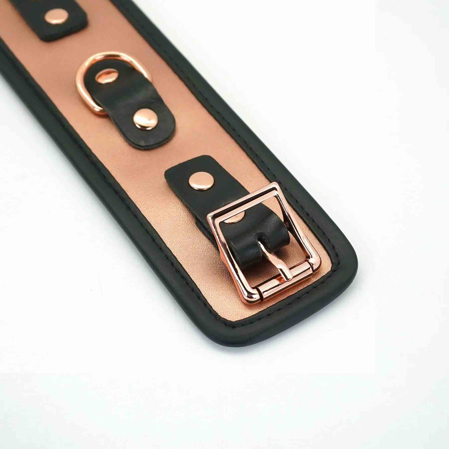 A close up of the buckle on the Rose Gold Memory Leather Cuffs with Faux Fur LIning.