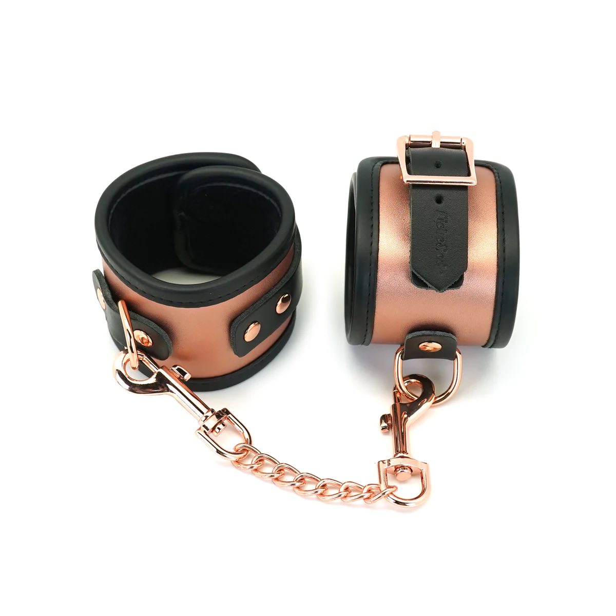 The Rose Gold Memory Leather Cuffs with Faux Fur LIning, buckled and closed with one cuff on its side with buckle at the top.