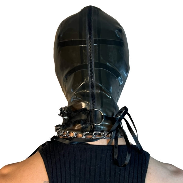 A model wearing translucent grey open mouth and eye basic latex hood, rear view.