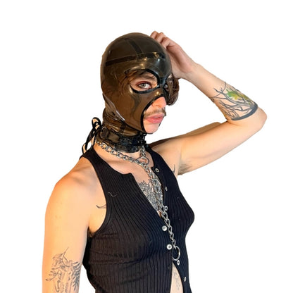 A model wearing translucent grey open mouth and eye basic latex hood, side view.