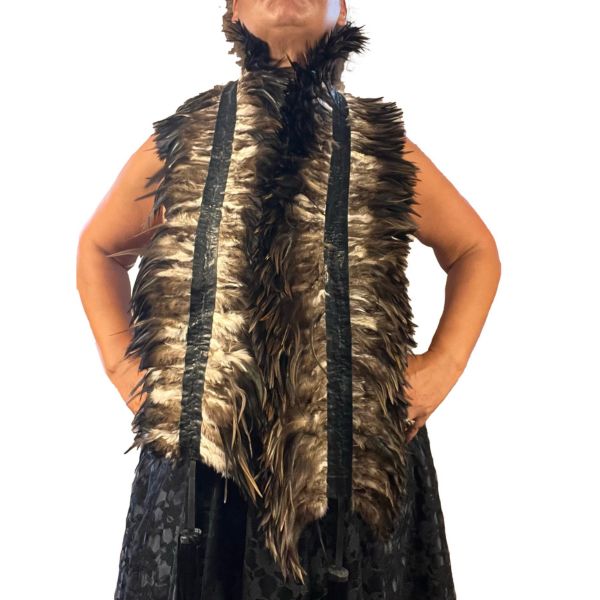 A model wearing the brown latex feather boa draped around their shoulders.