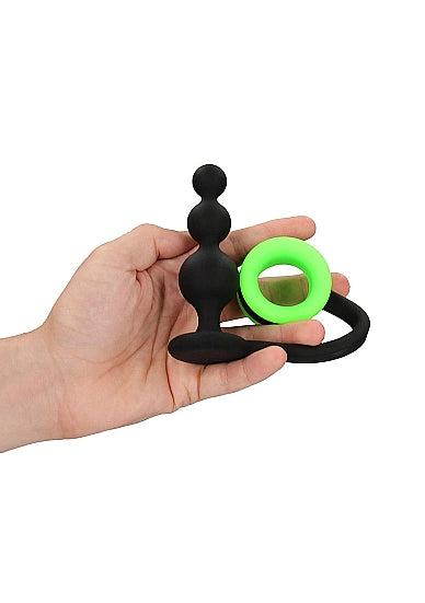 A hand holding the Glow Beads Butt Plug with Cock Ring.