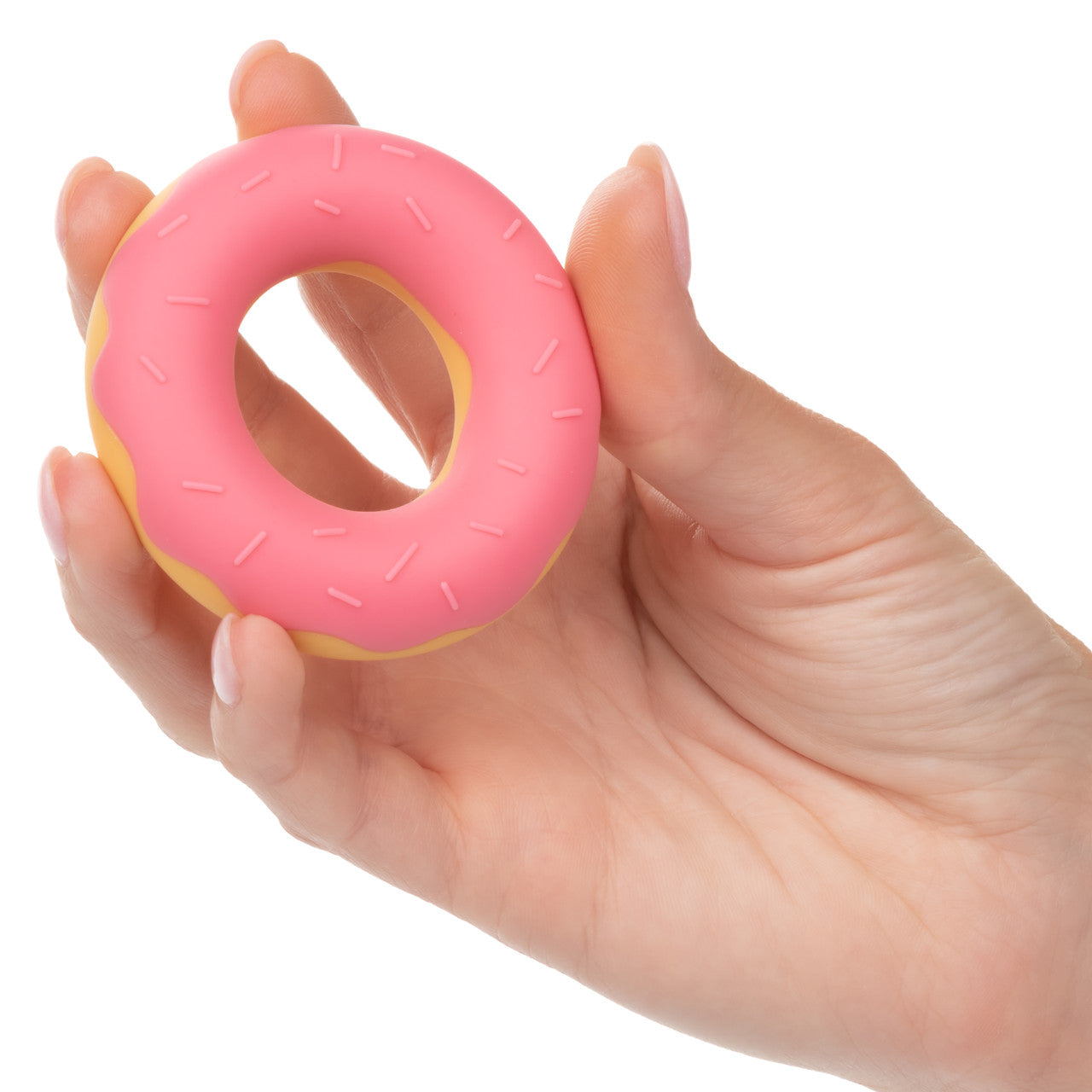 A hand holding the Dickin Donuts Silicone Cock Ring.
