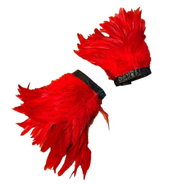 The red latex feather cuffs against a white background.