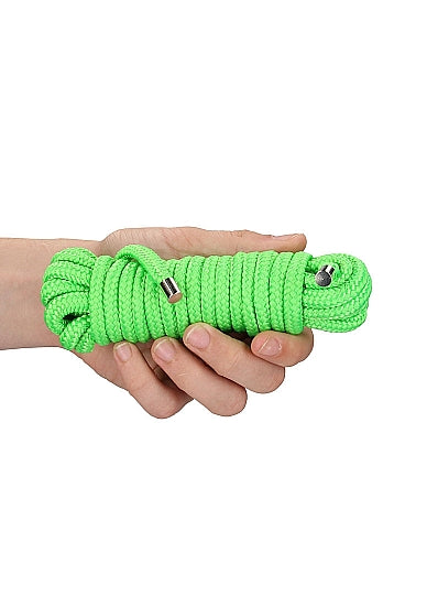 A hand holding a bundle of Glow Rope.
