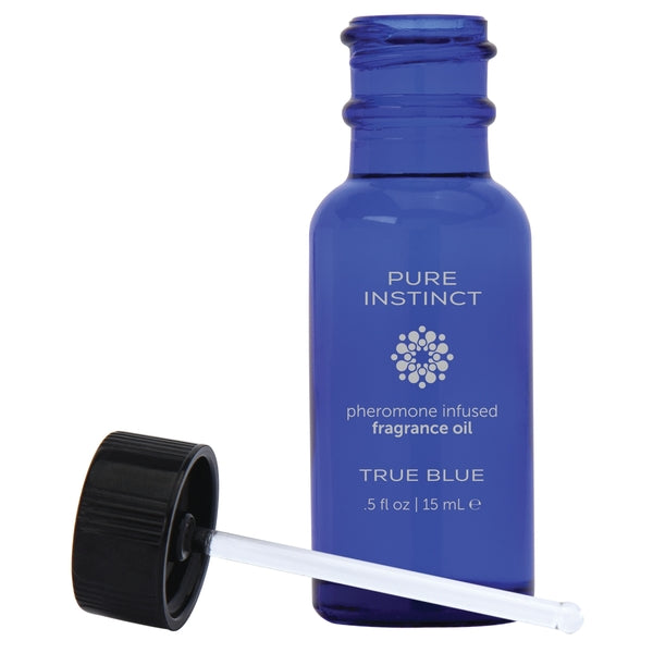 A .5 ounce bottle of Pure Instinct True Blue Pheromones with its top off.