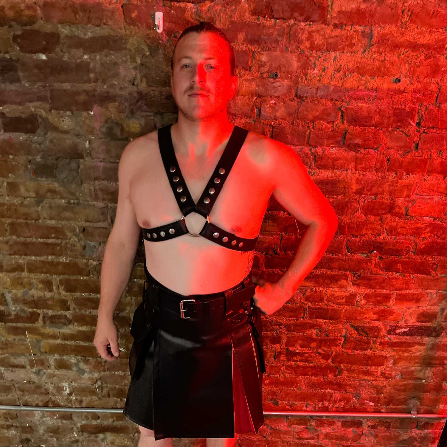 Model wearing classic 1.5" X-Harness with limited edition vinyl hybrid pride flag Heritage Kilt