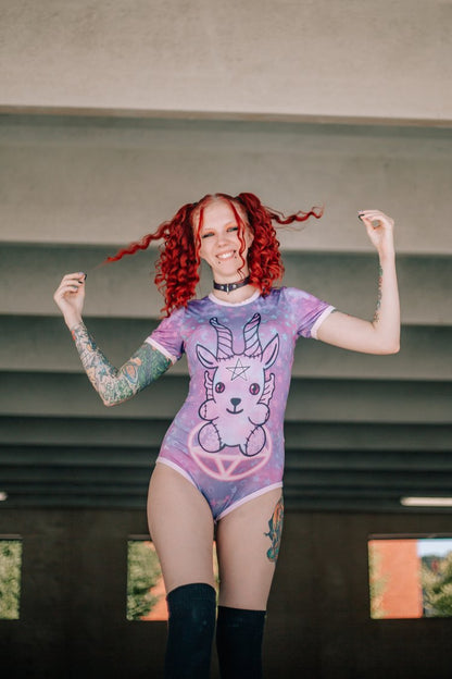 A model with red hair in pigtails wearing the Demon Onesie.