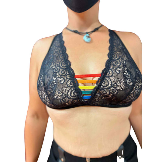 A model wearing the rainbow pride lace lace strap bra, front view.