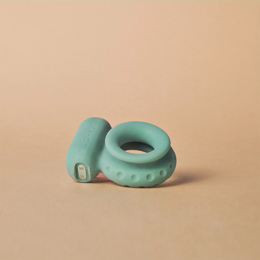 A side view of the classic jade OhNut Vibrating cock ring.