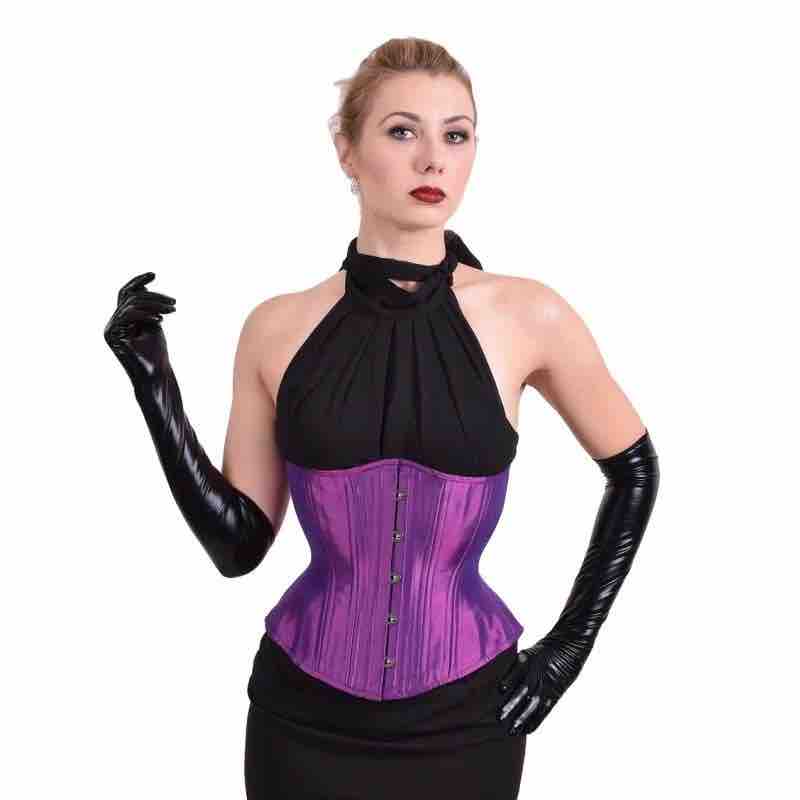 A model wearing the Electric Purple Mid-Length Underbust Corset - Hourglass over a black dress with black gloves.