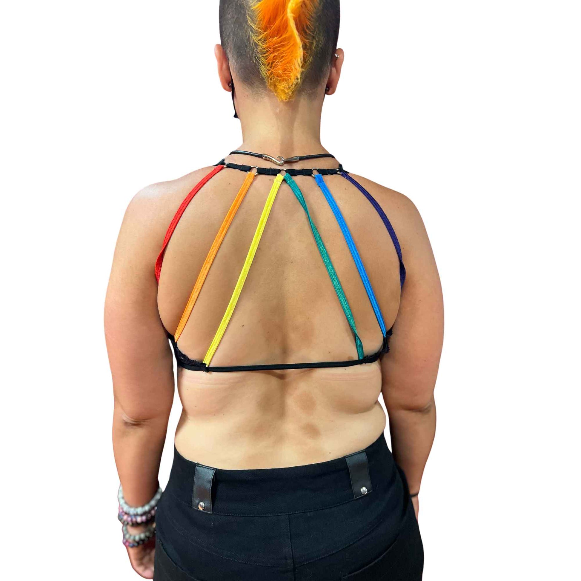 A model wearing the rainbow pride lace lace strap bra, rear view.