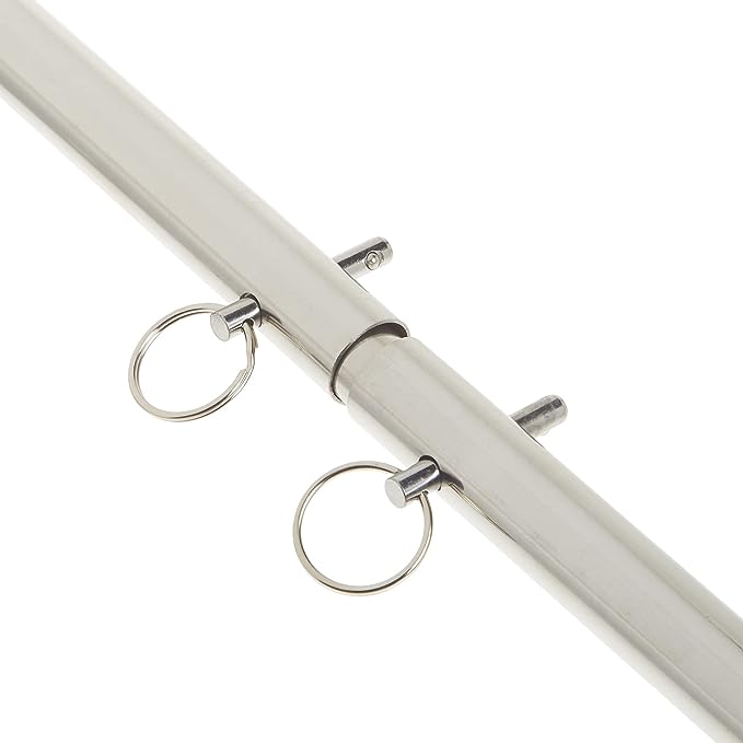 A close up of the keys holding the center of the silver Kink Lab Adjustable Spreader Bar together.