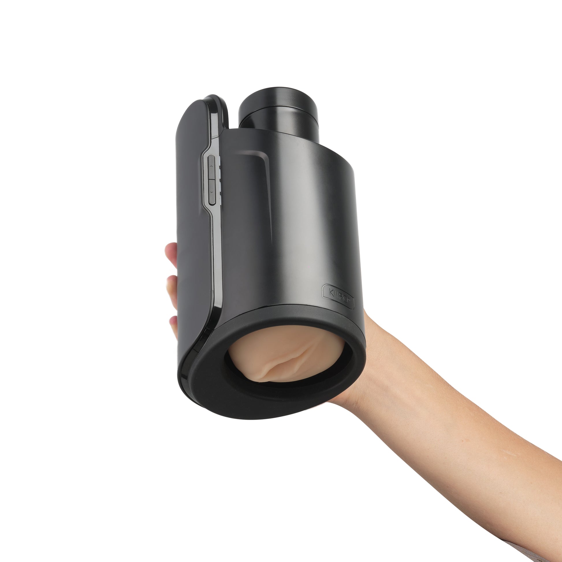 A hand holding the Kiiroo Keon Rechargeable Interactive Masturbator with a stroker attached.