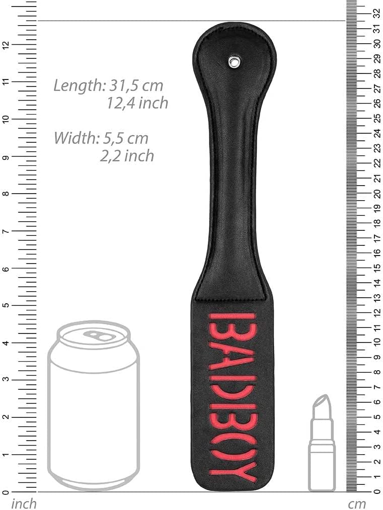 An illustration of the Bad Boy Impressions Paddle with rulers standing next to a cola can and a lipstick for size comparison.