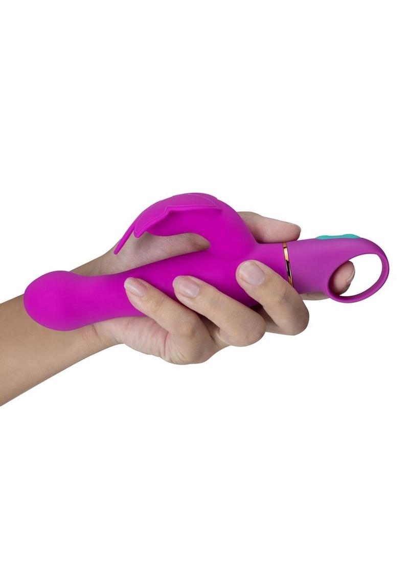 A hand holding the Aria Naughty AF Silicone Vibrator.