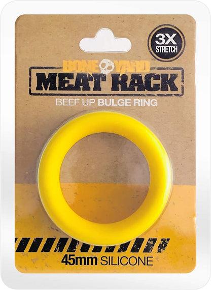 The yellow Meat Rack Cock Ring in its packaging.