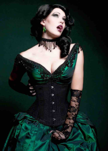 A model wearing the Black Rose Brocade Mid-Length Underbust Corset- Slim over a green satin gown, front view.
