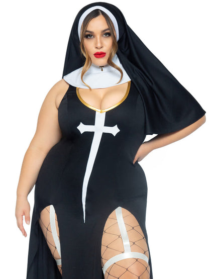 A mid length view of a plus size model wearing the 3 pc. Sultry Sinner Nun Costume with fence net stockings.