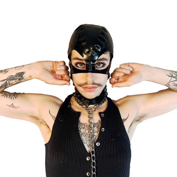 A model wearing black open mouth and eye basic latex hood, front view.