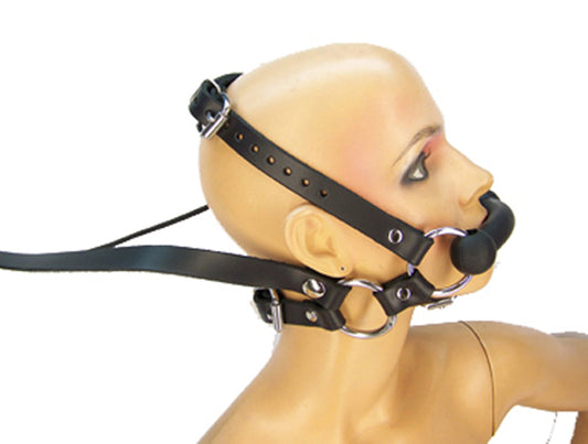 The side view of a mannequin head wearing the Pony Bit with reins attached.