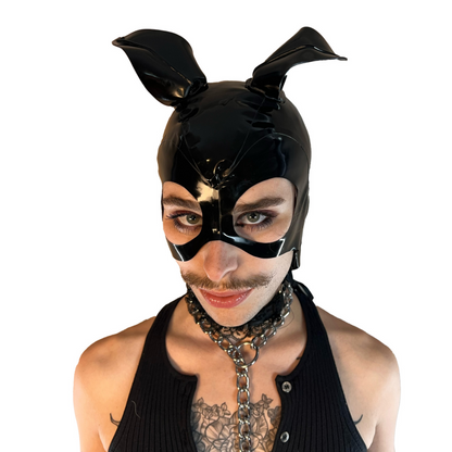 A model wearing black with magnetic ears open mouth and eye basic latex hood, front view.