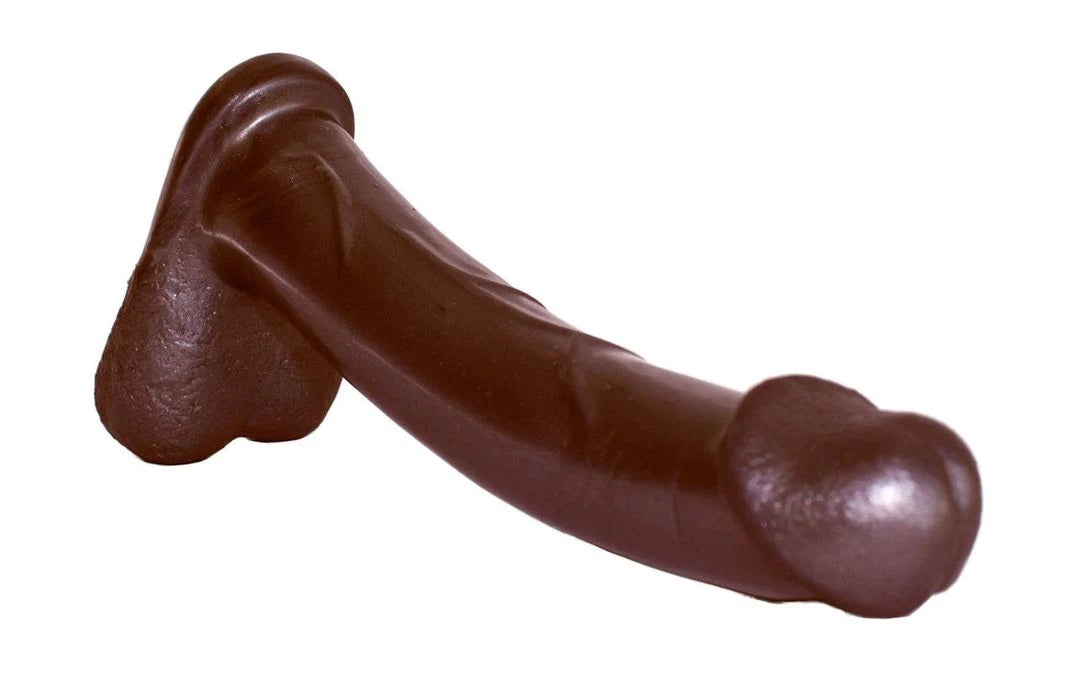 The dark Admiral Dual Density Dildo laying with balls down.