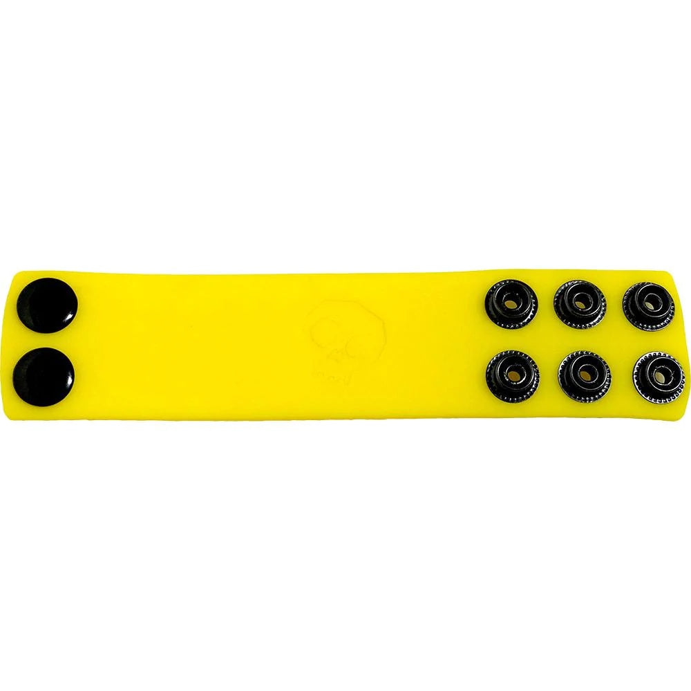 The yellow Boneyard Silicone Ball Strap laid out flat with snaps side up.