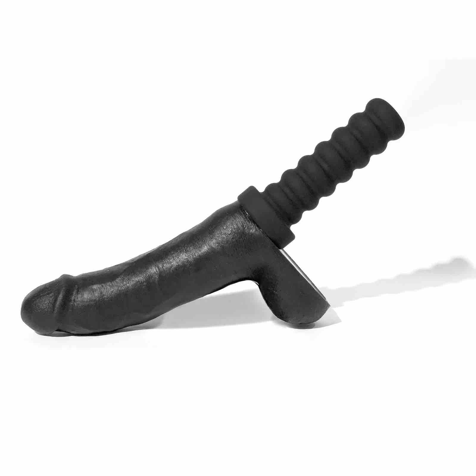 The 8 inch Boneyard Silicone Cock with its handle attqched.