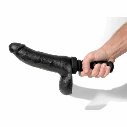 A hand holding the 8 inch Boneyard Silicone Cock  by its attached handle.