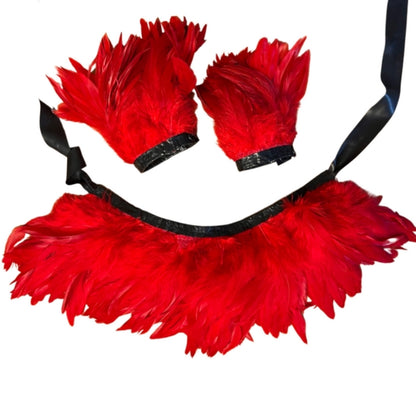 The red latex feather cuffs & collar set against white background.