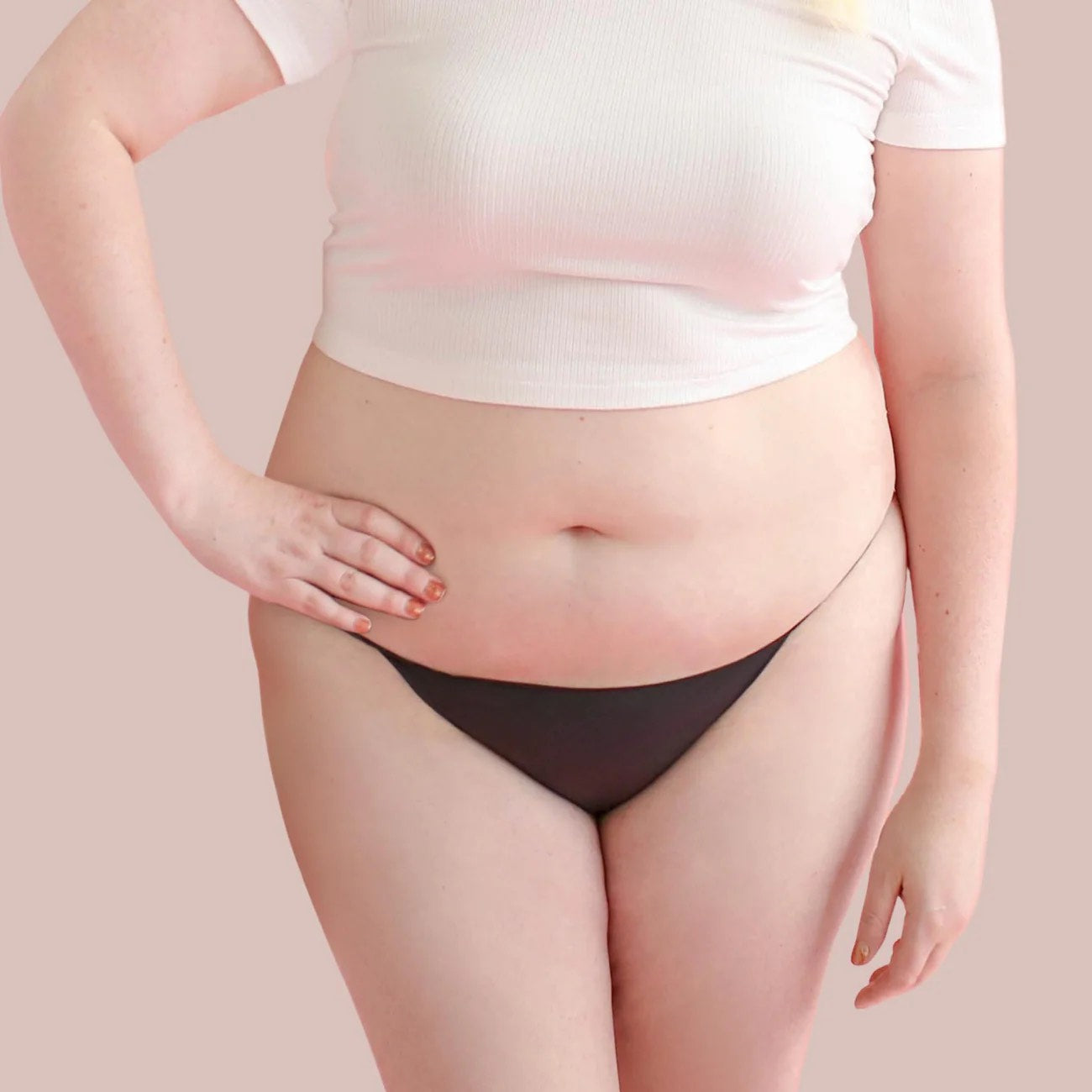 A plus size model wearing the opaque black bikini Lorals Panties For Pleasure and Comfort, front view.