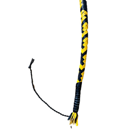 A close up of the tail of the yellow and black braided Singletail Whip.