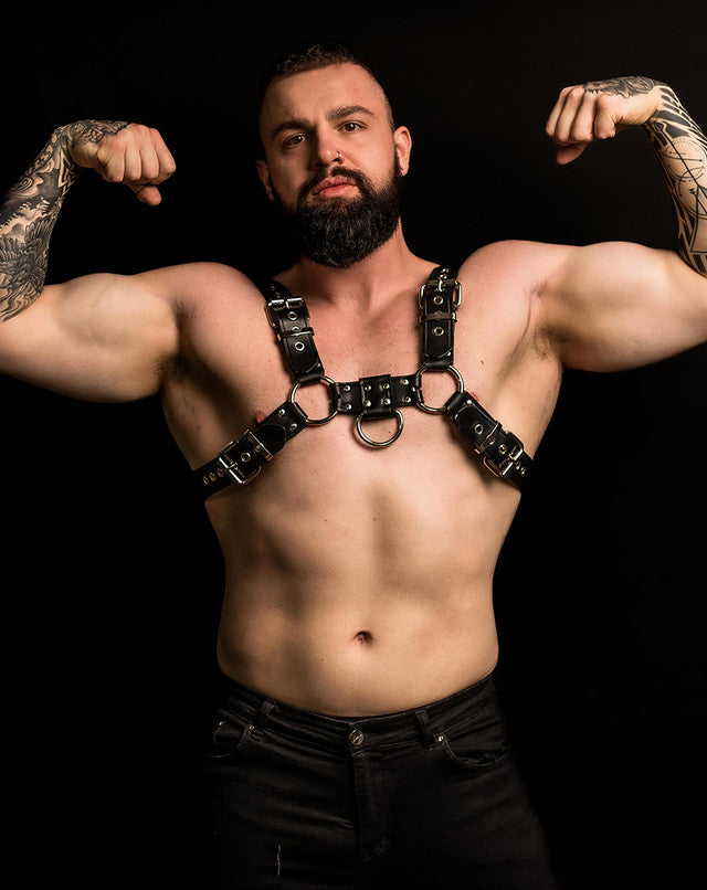 A model wearing the Leather Bulldog Harness with D-Ring, front view.