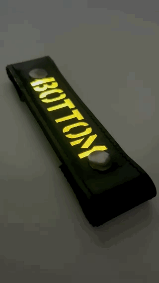 A Gif of the "BOTTOM" Glow Center Strap flashing in different colors.