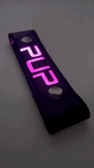 A Gif of the "PUP" Glow Center Strap flashing in different colors.