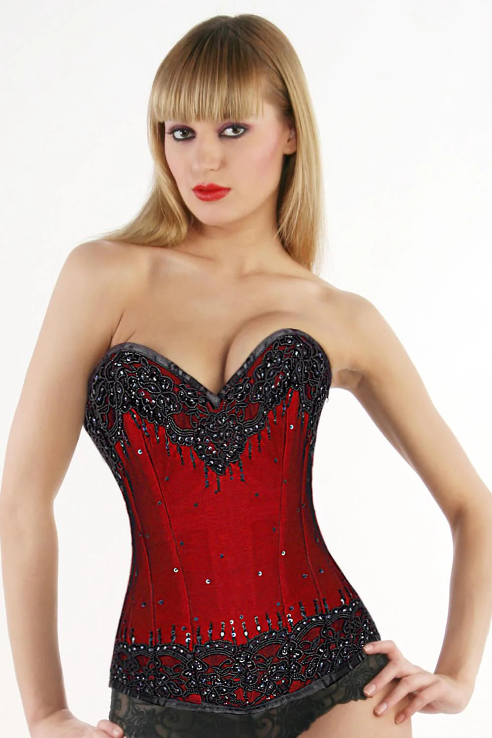 A model wearing the red and black Beaded Lace Overlay Couture Corset, front view.