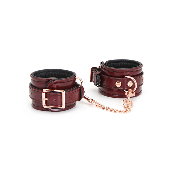 The Burgundy Leather Cuffs with Rose Gold Hardware closed and buckled.