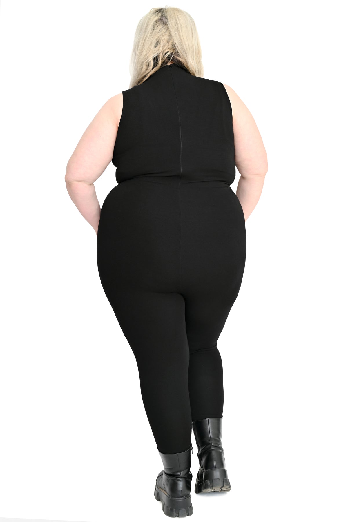 Rear view of plus size model wearing signarture high neck catsuit
