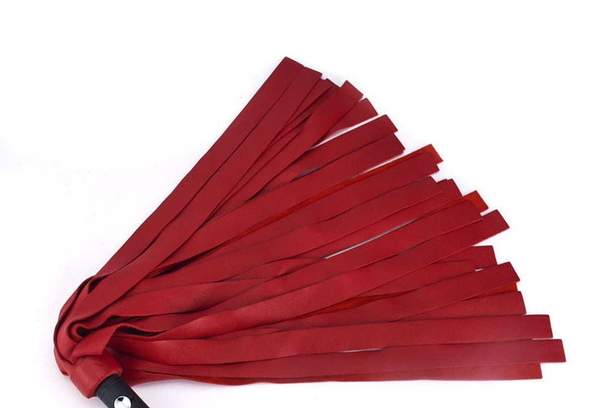 The Red Deerhide Unique Kink Deerskin Flogger Head with handle attached.