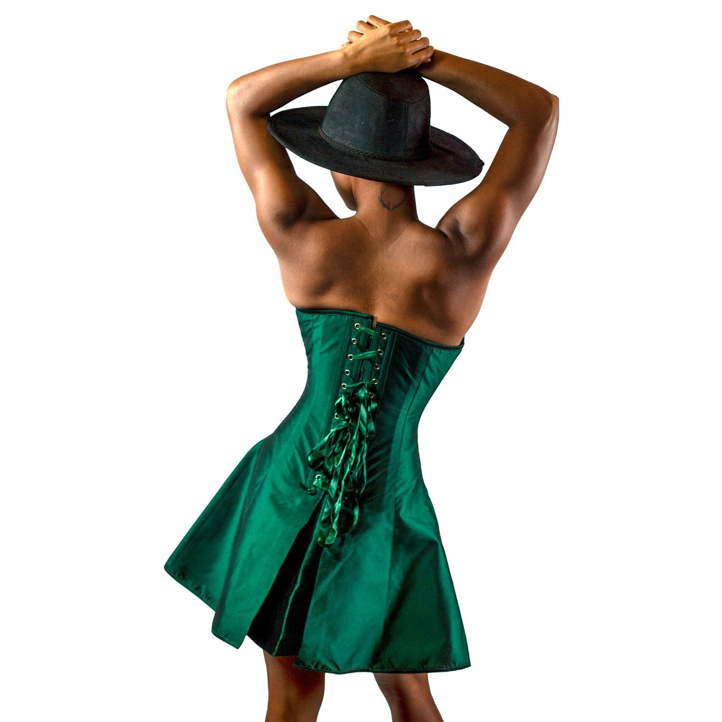 A model wearing the Forest Green Taffeta Skirted Overbust Corset, rear view.