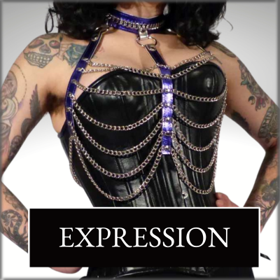 Expression, with your fashion choices , pictured model wearing leather corset with draping chain body harness