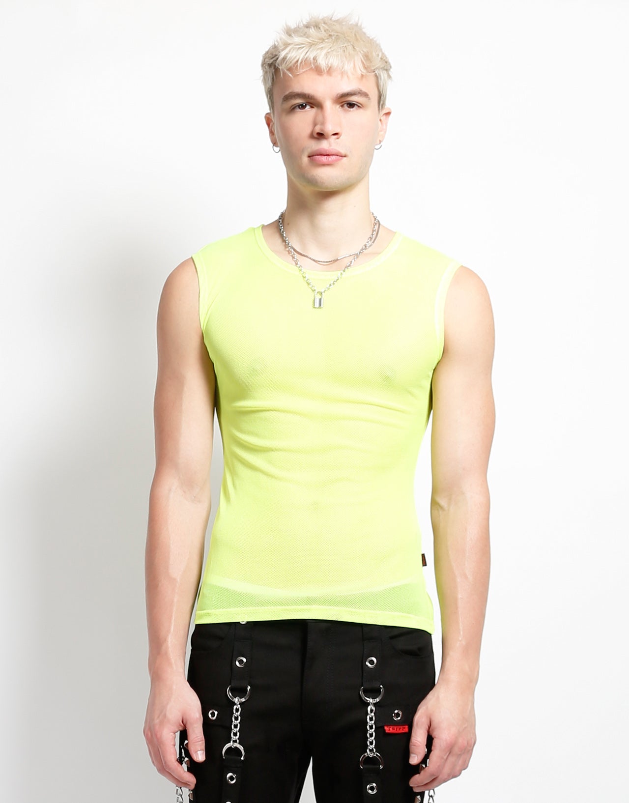 The yellow Sleeveless Fishnet Muscle Tank on a model wearing black pants, front view.