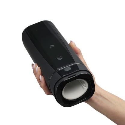The Kiiroo Onyx+ held in a hand, full view.