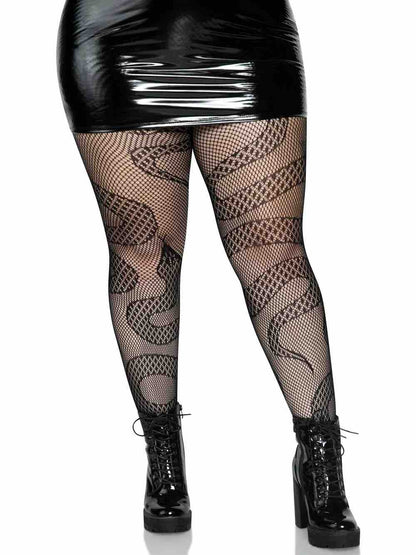 A plus size model wearing the Snake Net Tights with black wetlook skirt and platform boots.