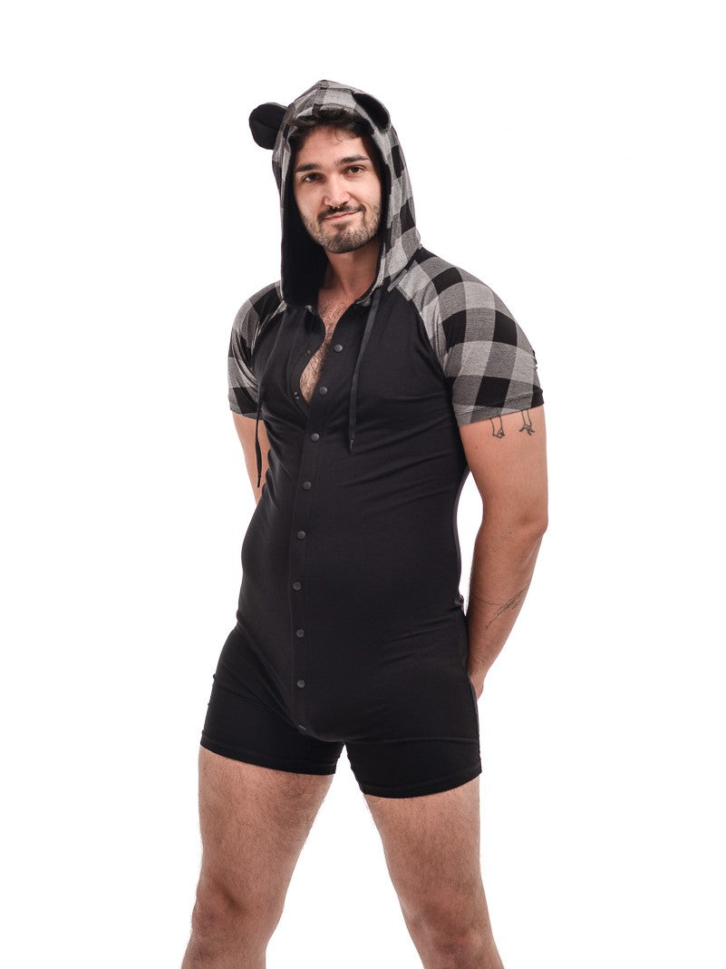 A model showing the front of the grey with black Bear Plaid Bamboo Onesie with hoodie up and some of the buttons unsnapped.