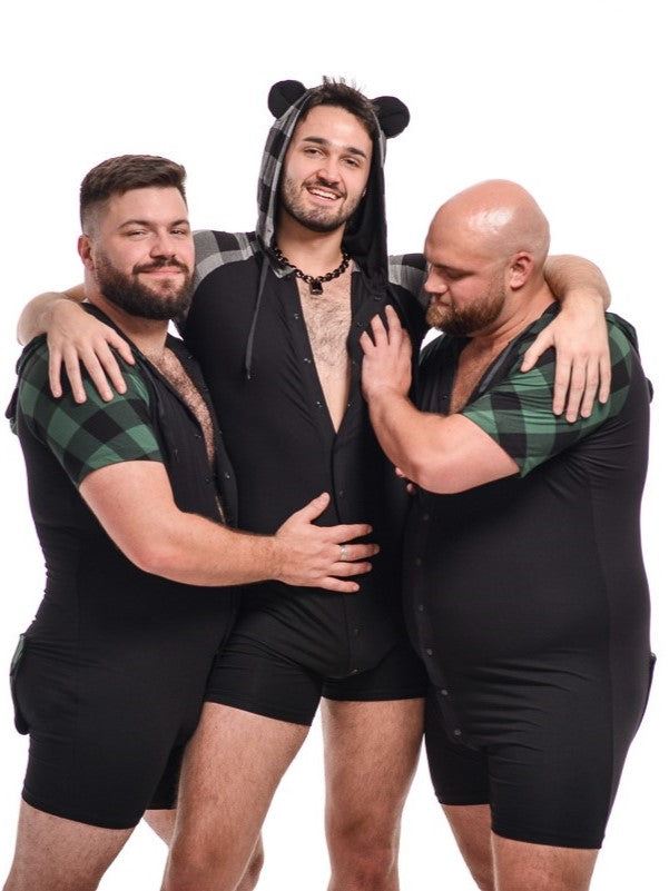 Three models wearing Plaid bamboo bear onesies in green and black as well as gray and black.